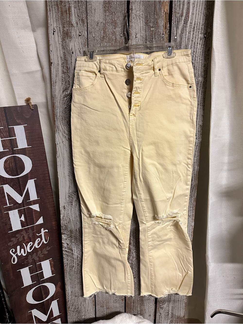 High-Rise Flare Women’s Jeans in Pale Yellow - Distressed Knee Detail